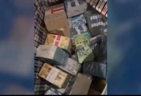 Клетчатые сумки с деньгами: кадры задержания бухгалтера отдела образования